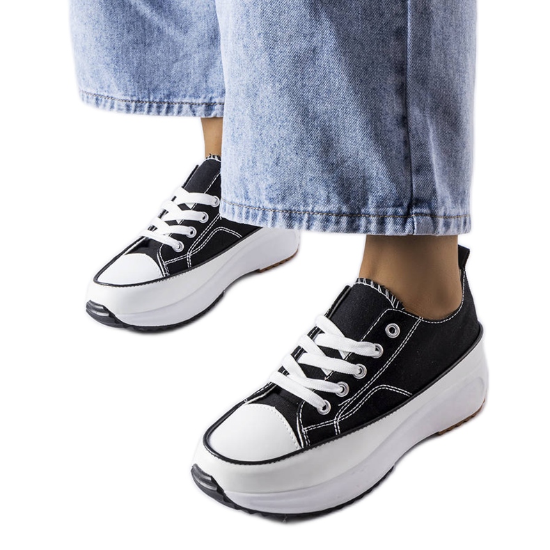 Black sports sneakers on the McKeylor platform