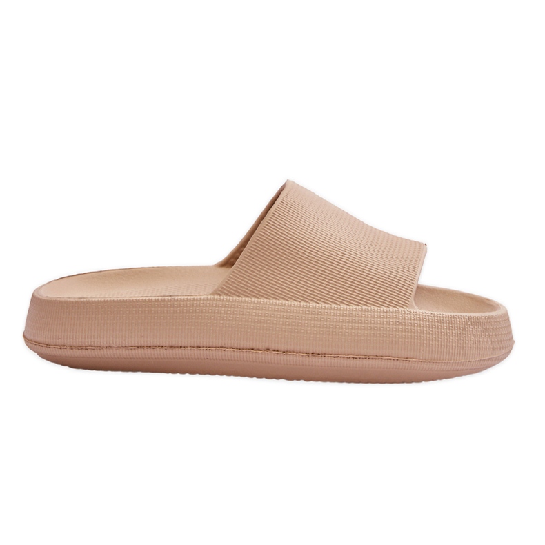 Fashionable Light Sandals On A Beige Rebel Massive Sole