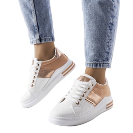 White sneakers with pink inserts from Deans