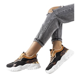 Black sneakers on an irregular sole from Alta