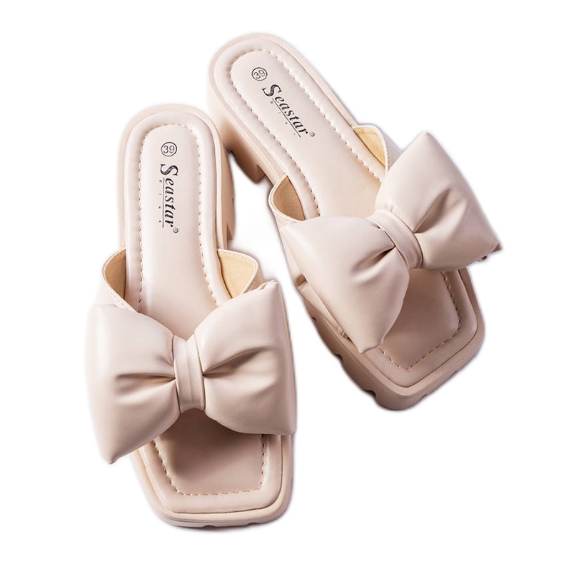 Beige tractor sole slides from Bossé