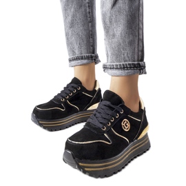 Black and gold platform sneakers from Therrien