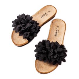 Black slippers decorated with flowers