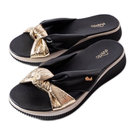 Black and gold wedge sandals from Luce