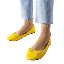 Yellow ballerinas decorated with a Vaillancour bow