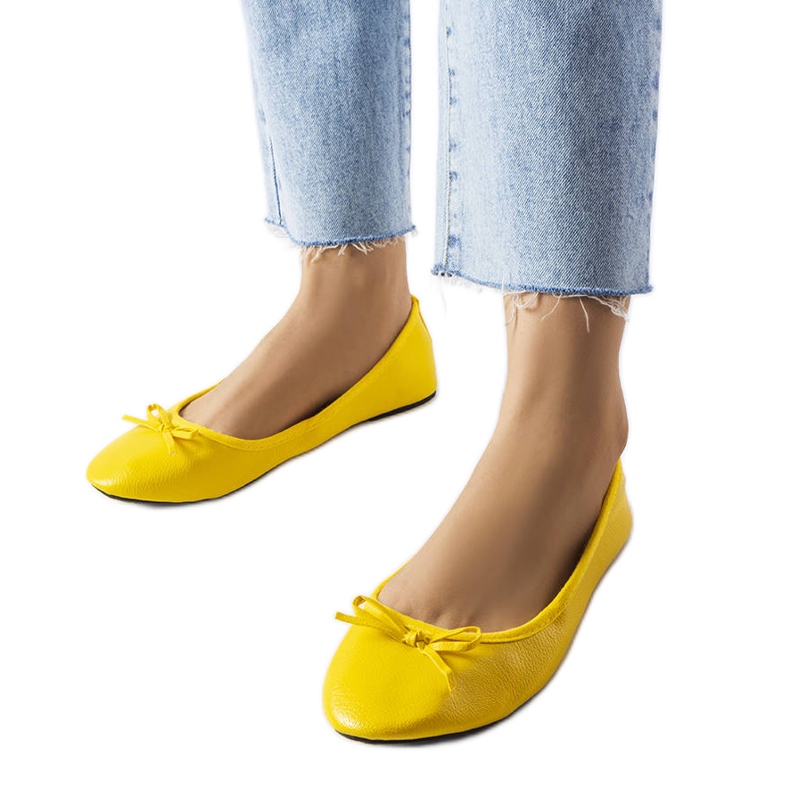 Yellow ballerinas decorated with a Vaillancour bow