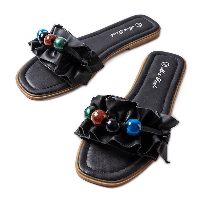 Black ruffled slides from Fortier