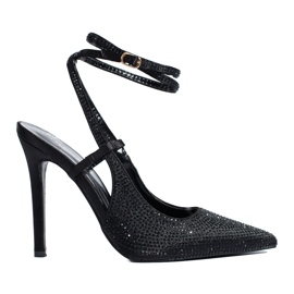 Black pumps on a high heel with crystals from Shelovet