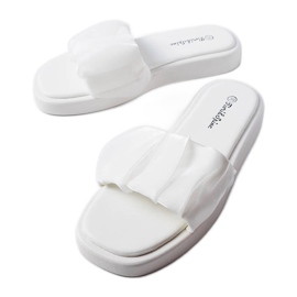 White sliders decorated with Boulevard ruffles White sliders decorated with Boulevard ruffles