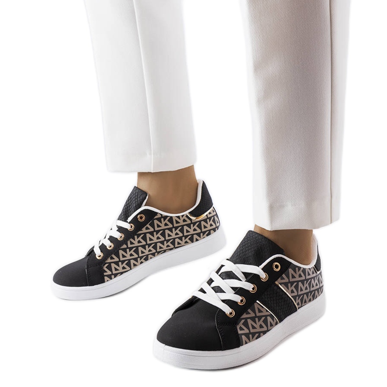 Black sneakers decorated with the Bolduc monogram
