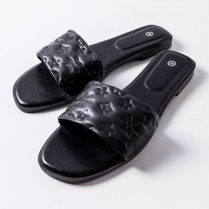 Black flat sandals from Amalie