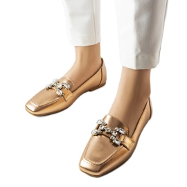 Rose gold loafers with rhinestones from Marechal golden