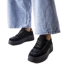 Black platform sneakers from Fabienne