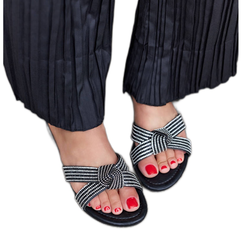 Black flip-flops decorated with Loreto zircons