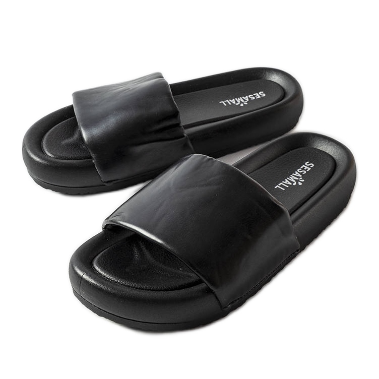 Black flip flops on the Franco platform