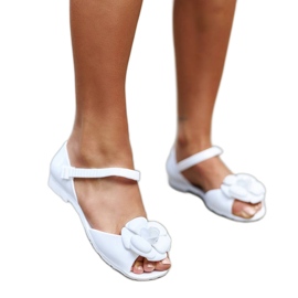 White ballerinas with a flower