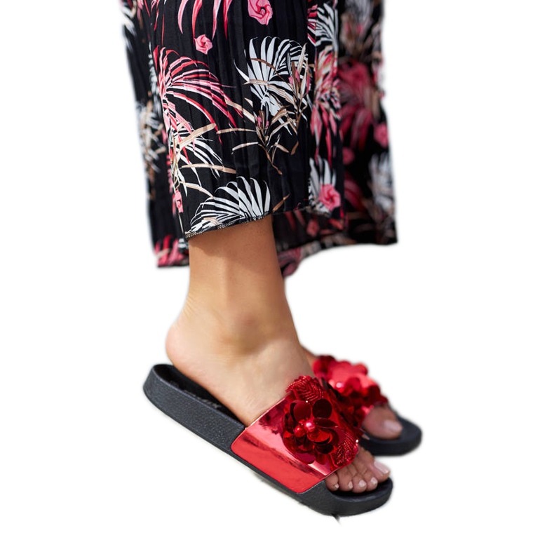 Red slides with a decorative upper from Caggio