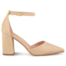 Beige pumps on a post fastened at the ankle