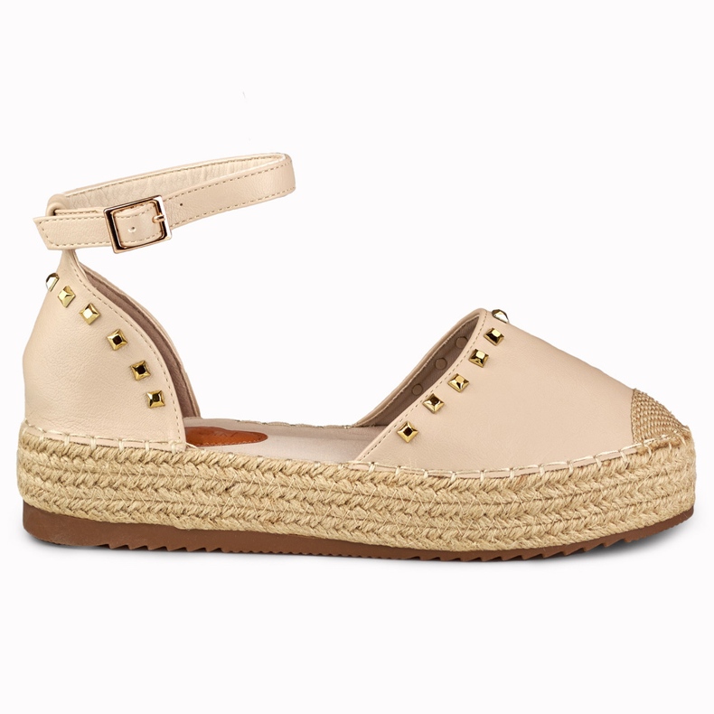 Beige espadrilles with studs fastened at the ankle