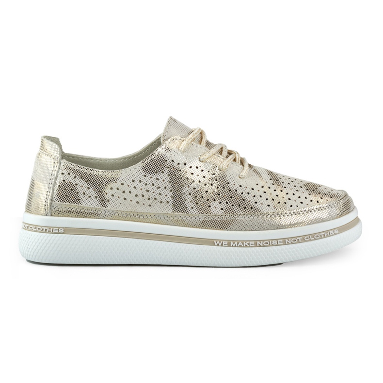 Women's golden sports shoes made of genuine leather