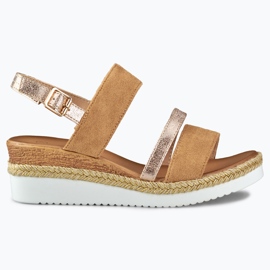 Ladies' beige sandals on a low wedge