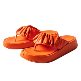 Orange ruffled flip-flops