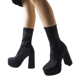 Black satin boots on a massive post from Glus