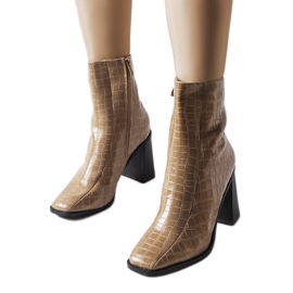 Beige insulated ankle boots with a crocodile pattern from Belluci