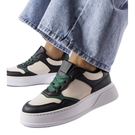 Black and green sneakers on the Baron platform