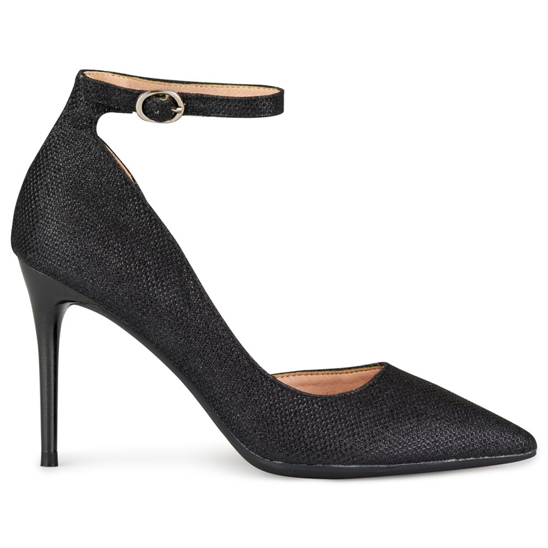 Shiny black pins fastened on the ankle
