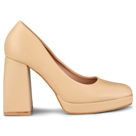 Beige pumps on a wide high heel