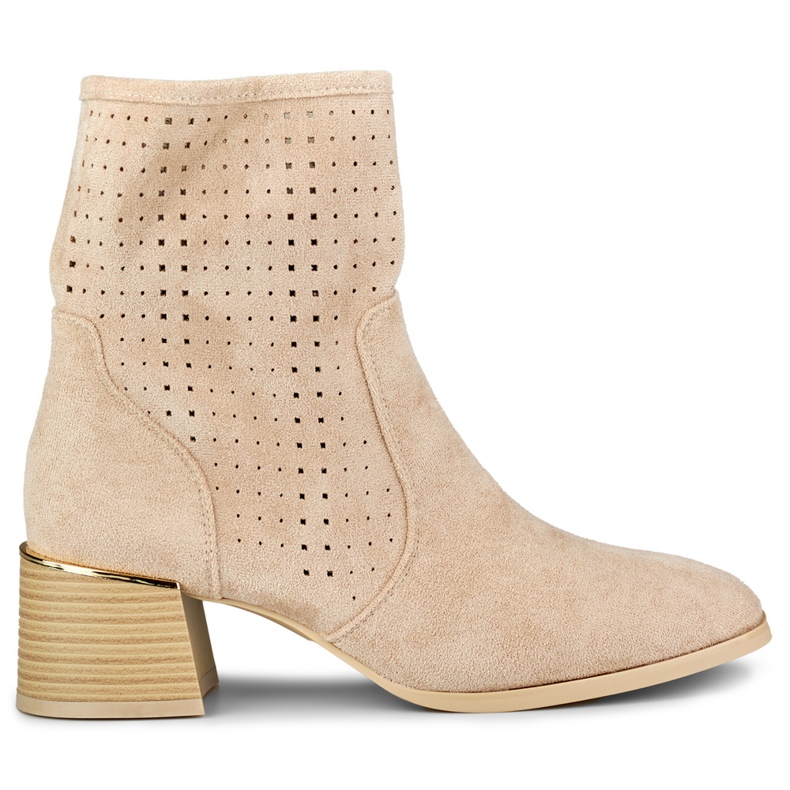 Light beige openwork women's boots on a low heel