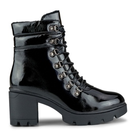 Lacquered black women's boots on the post