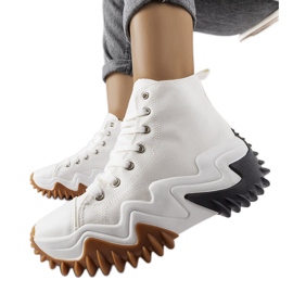 White sports sneakers with thick soles from Toro