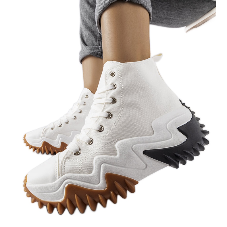 White sports sneakers with thick soles from Toro