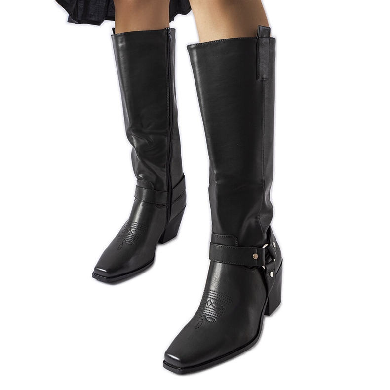 Black cowboy boots on the post