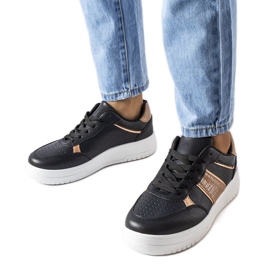 Black and gold sports sneakers from Parma