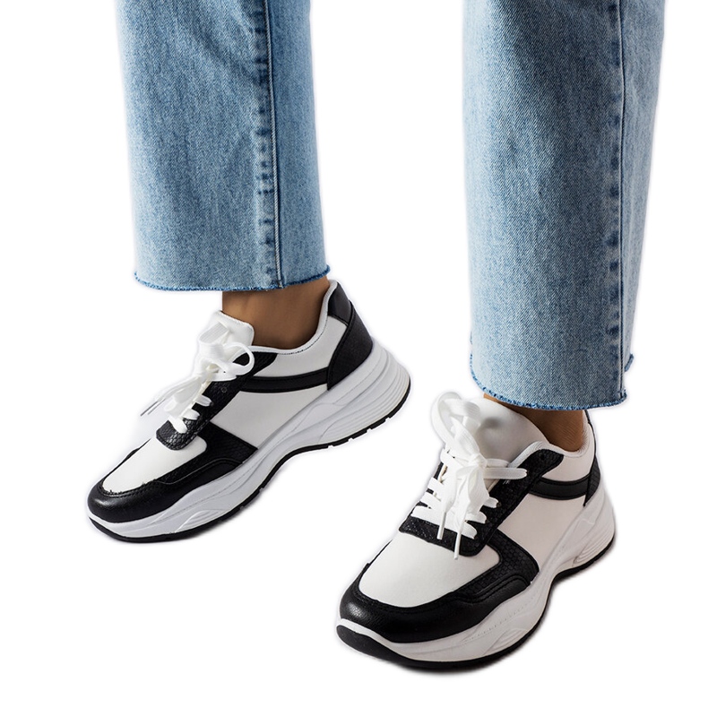 Black and white shoes with snakeskin accents from Diego