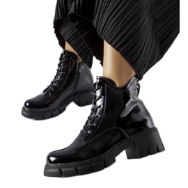 Black insulated patent ankle boots by Vinceza