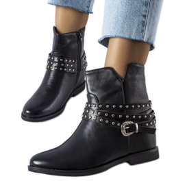 Black ankle boots with an Anchorage covered wedge