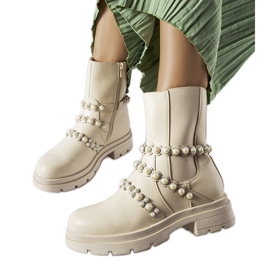 Beige ankle boots decorated with Callicratide pearls Beige ankle boots decorated with Callicratide pearls