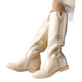 Beige wedge boots decorated with Vito snaps Beige wedge boots decorated with Vito snaps
