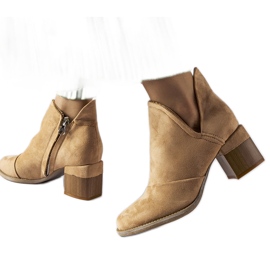 Beige ankle boots with an irregular upper by Busson