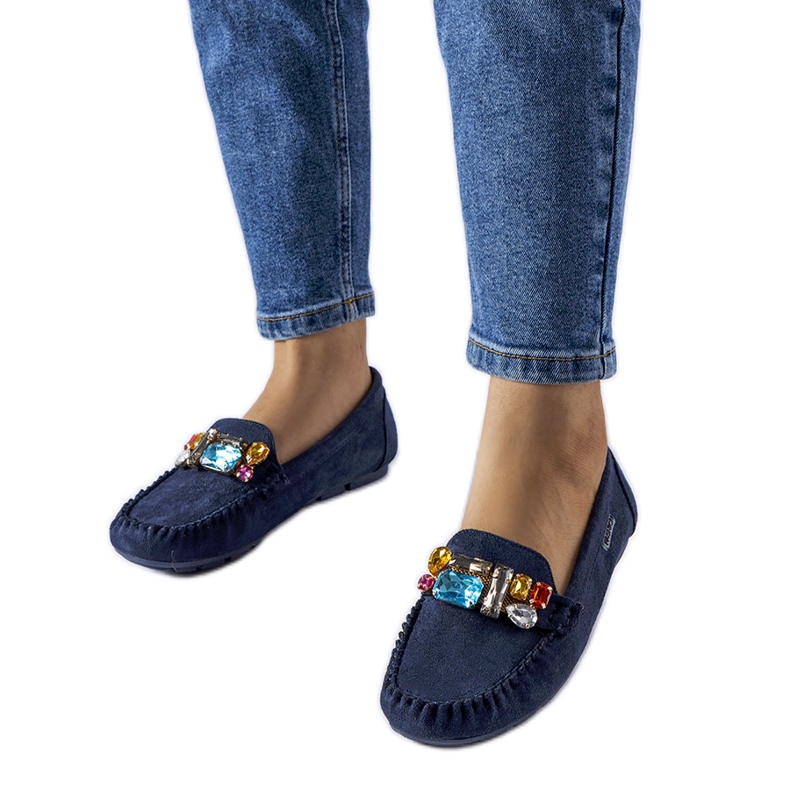 Navy blue moccasins decorated with Fusco trinkets