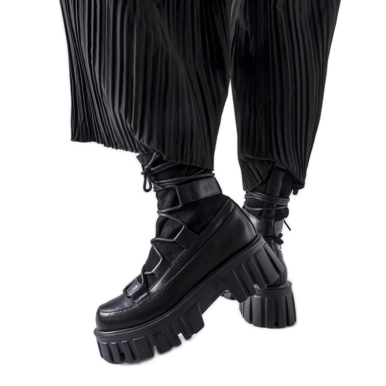 Black sock boots with a Colce tread