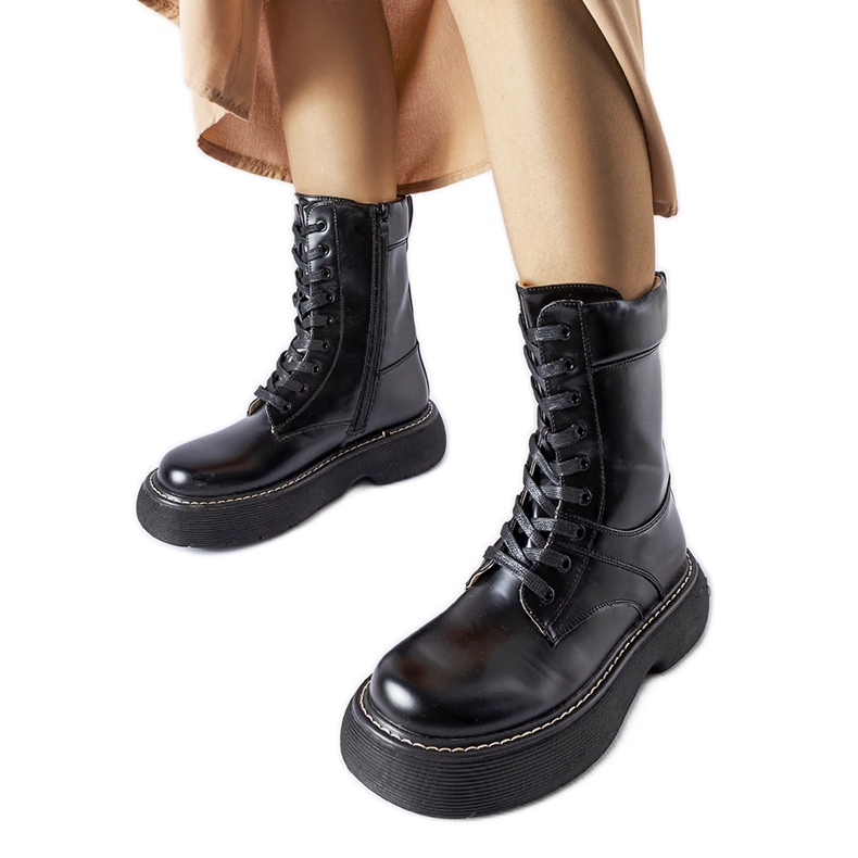 Black insulated workers' boots on the Davi platform