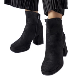 Black ankle boots on a massive Itaf heel