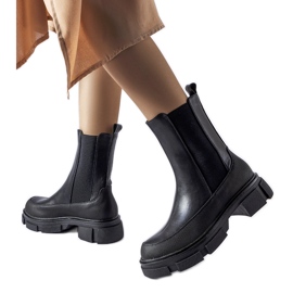 Black ankle boots with an elastic upper by Faisal Black ankle boots with an elastic upper by Faisal