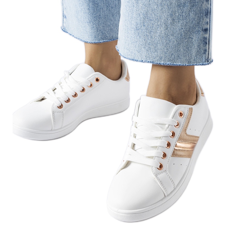 White sneakers with a rose gold Rizzo accent