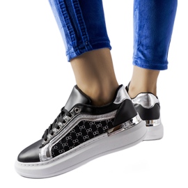 Black sneakers with silver Leo decoration